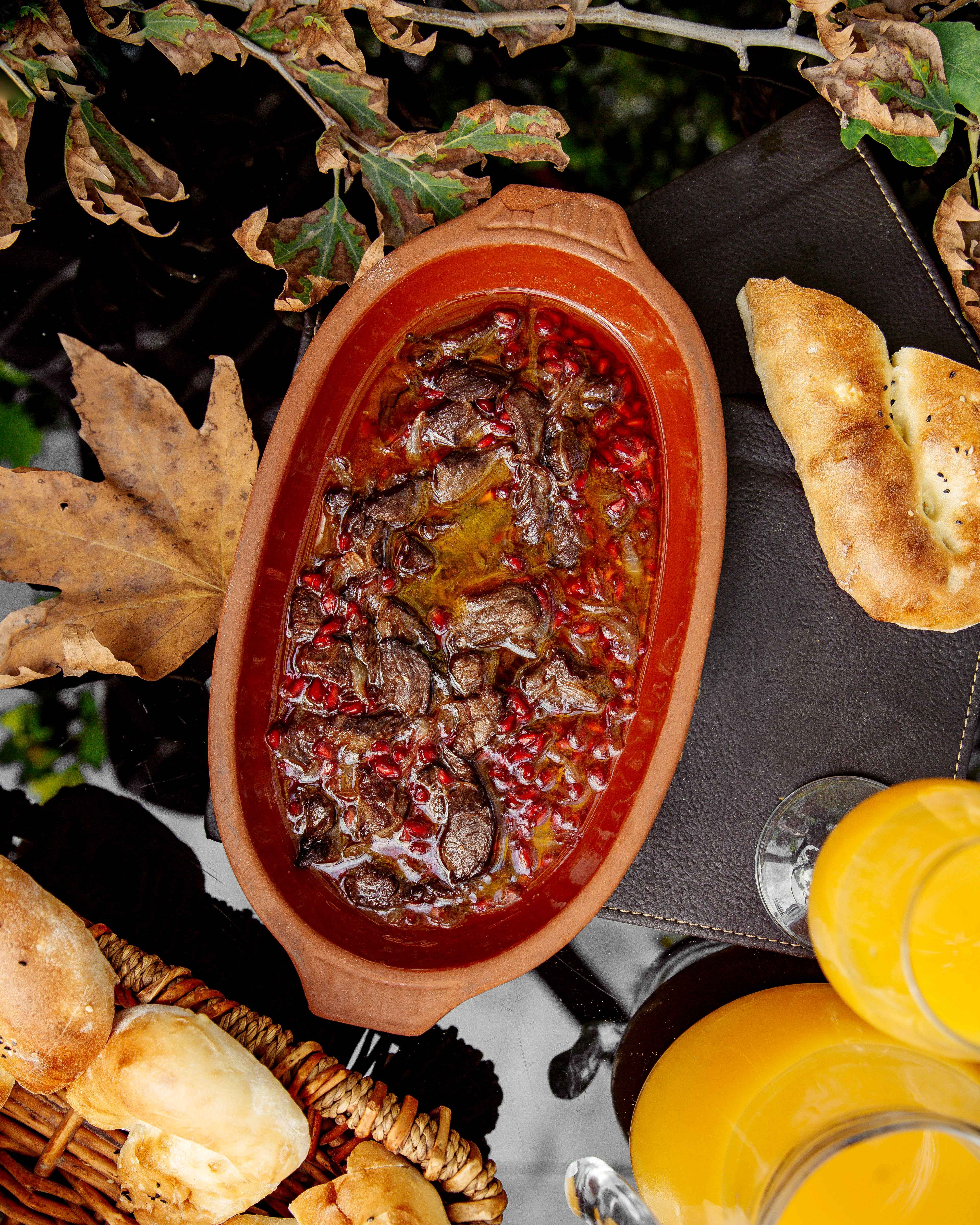 top view of lamb dish cooked with pomegranate and onion in oil